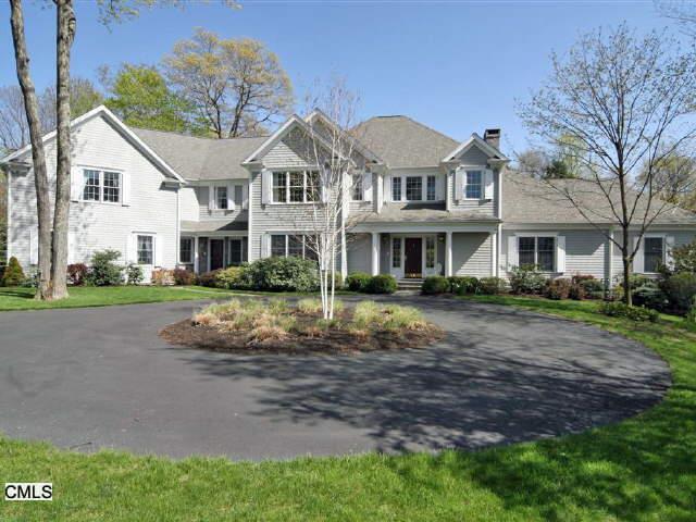 21 Lynch Brook Lane Ridgefield, CT 06877 - Photo 1 of 1 a front view of a house with a garden