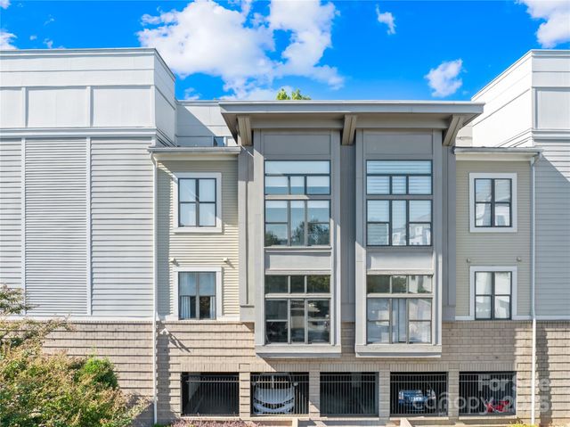 a front view of a building with a lot of windows