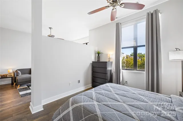 a bedroom with a bed and a chair