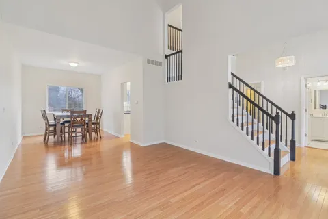 a view of dining room with furniture and wooden floor