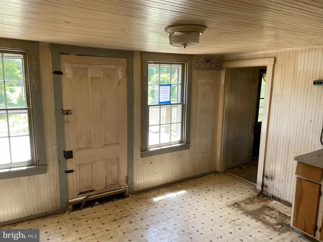 a view of a room that has a window in it