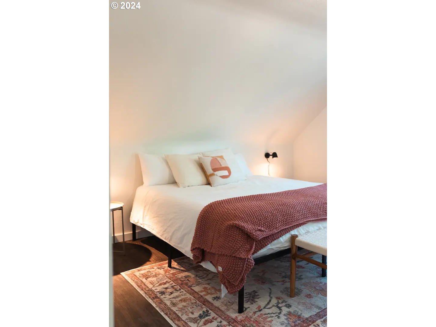 4840 Herrin Road Northeast Salem, OR 97305 - Photo 15 of 23 a spacious bedroom with a bed and a chair
