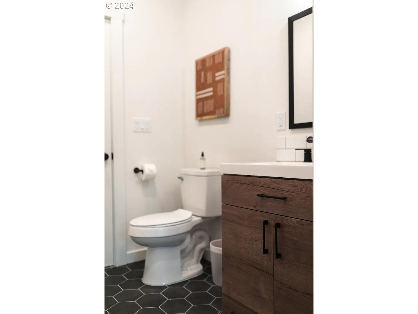 4840 Herrin Road Northeast Salem, OR 97305 - Photo 19 of 23 a bathroom with a toilet sink and mirror