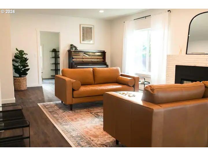 4840 Herrin Road Northeast Salem, OR 97305 - Photo 6 of 23 a living room with furniture and a fireplace