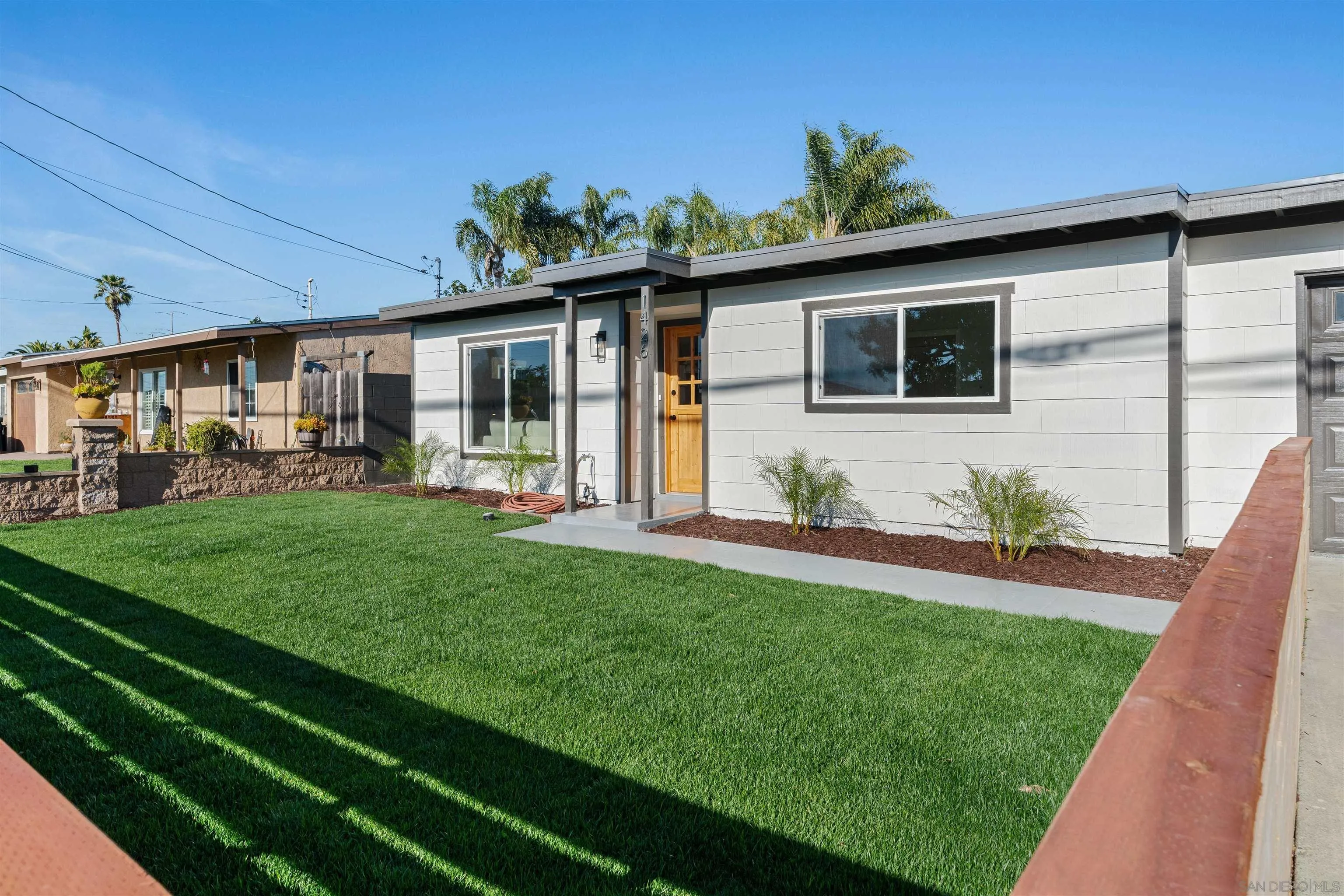 1426 Santa Rosa Street Oceanside, CA 92058 - Photo 7 of 73 a front view of house with yard and green space