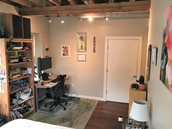 a workspace with furniture and wooden floor