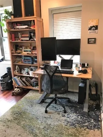 a view of a workspace with furniture