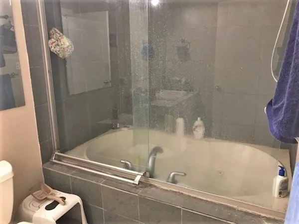 a bathroom with a tub and a shower