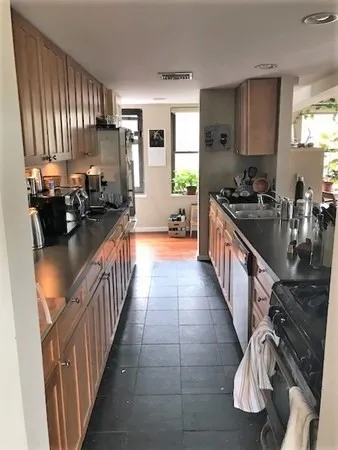 a large kitchen with lots of counter space and a sink