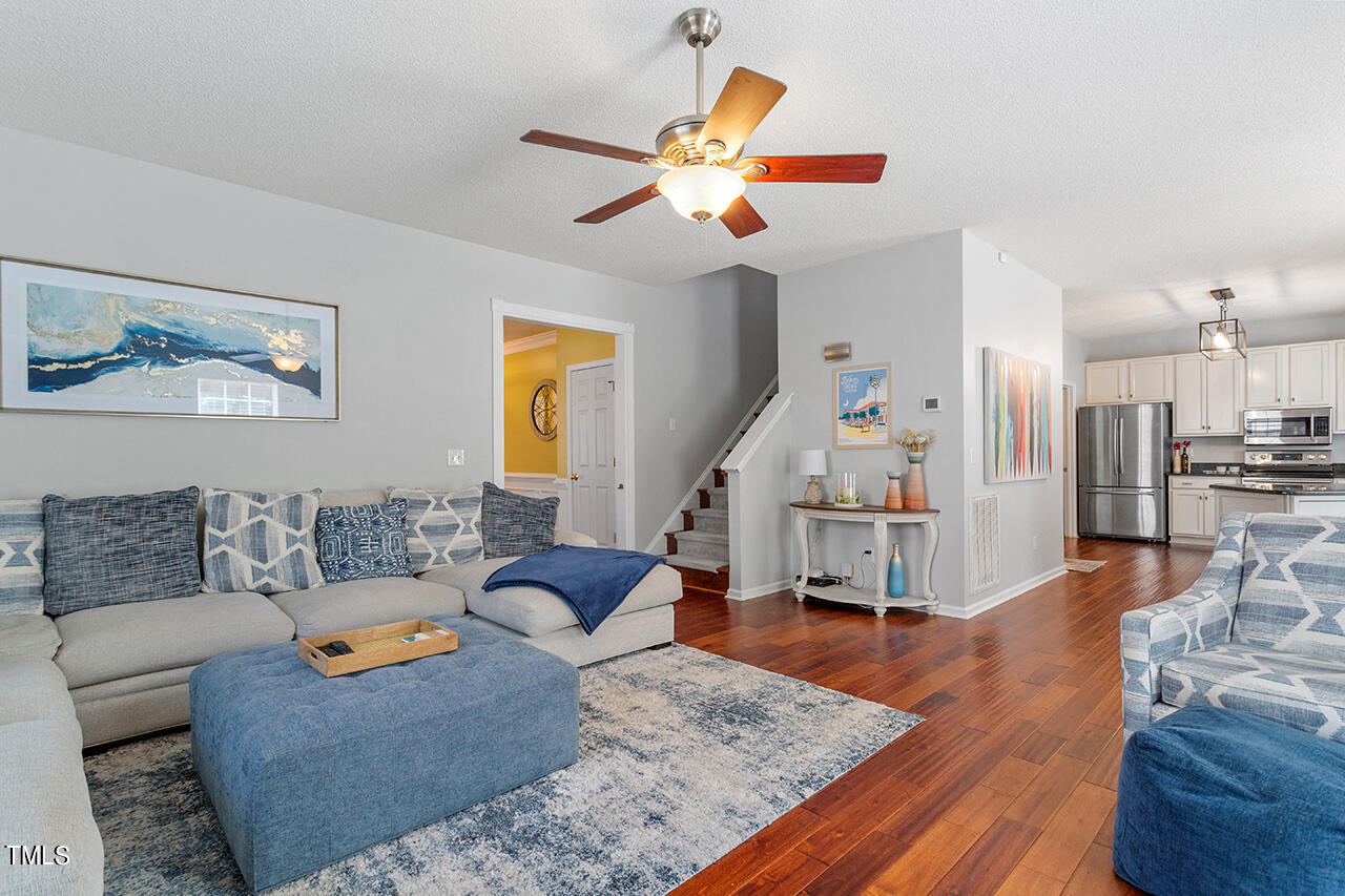 689 Seastone Street Raleigh, NC 27603 - Photo 9 of 34 a living room with furniture and wooden floor