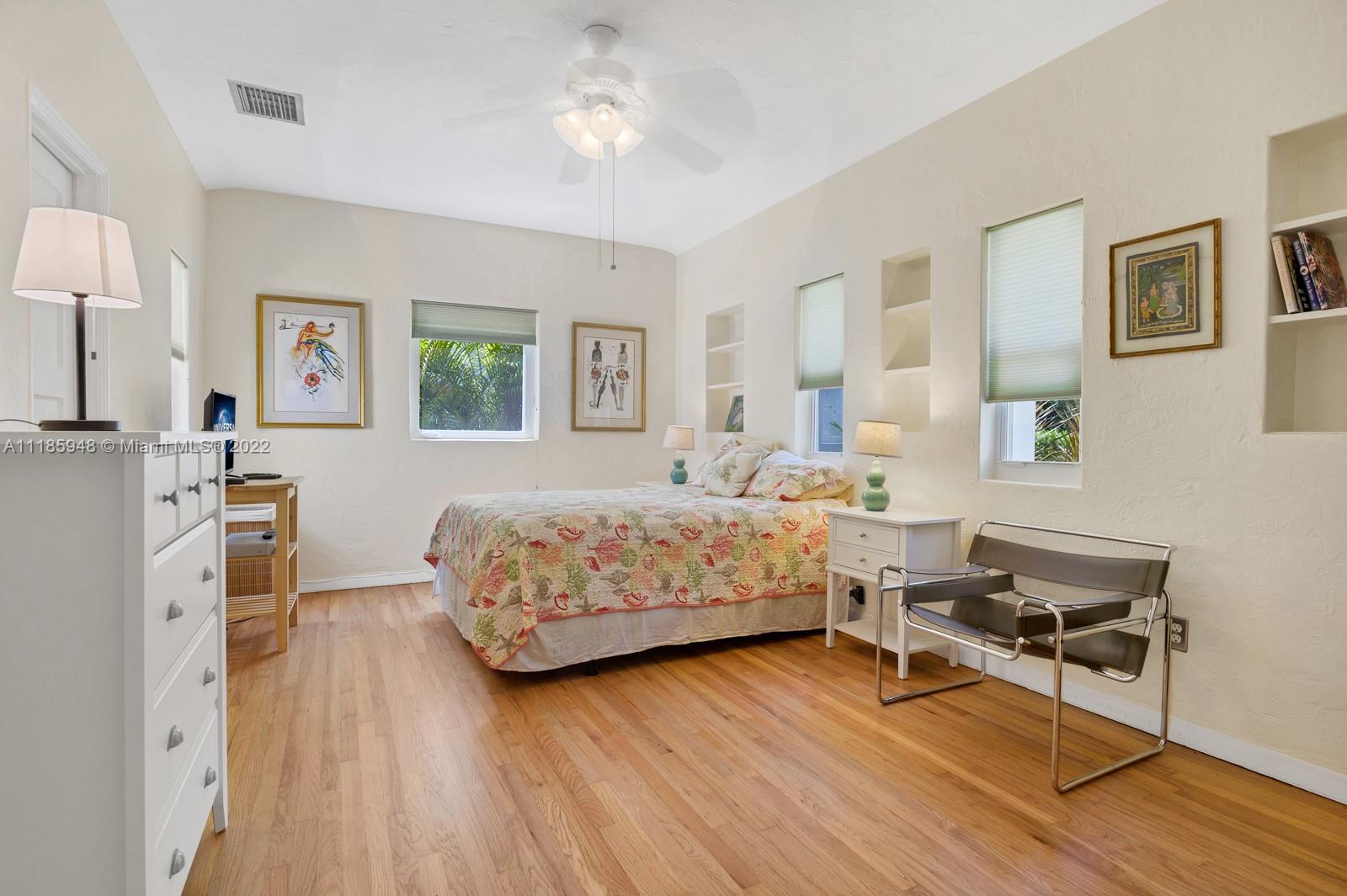 5429 Alton Road Miami Beach, FL 33140 - Photo 11 of 20 a bedroom with a bed and a table in it