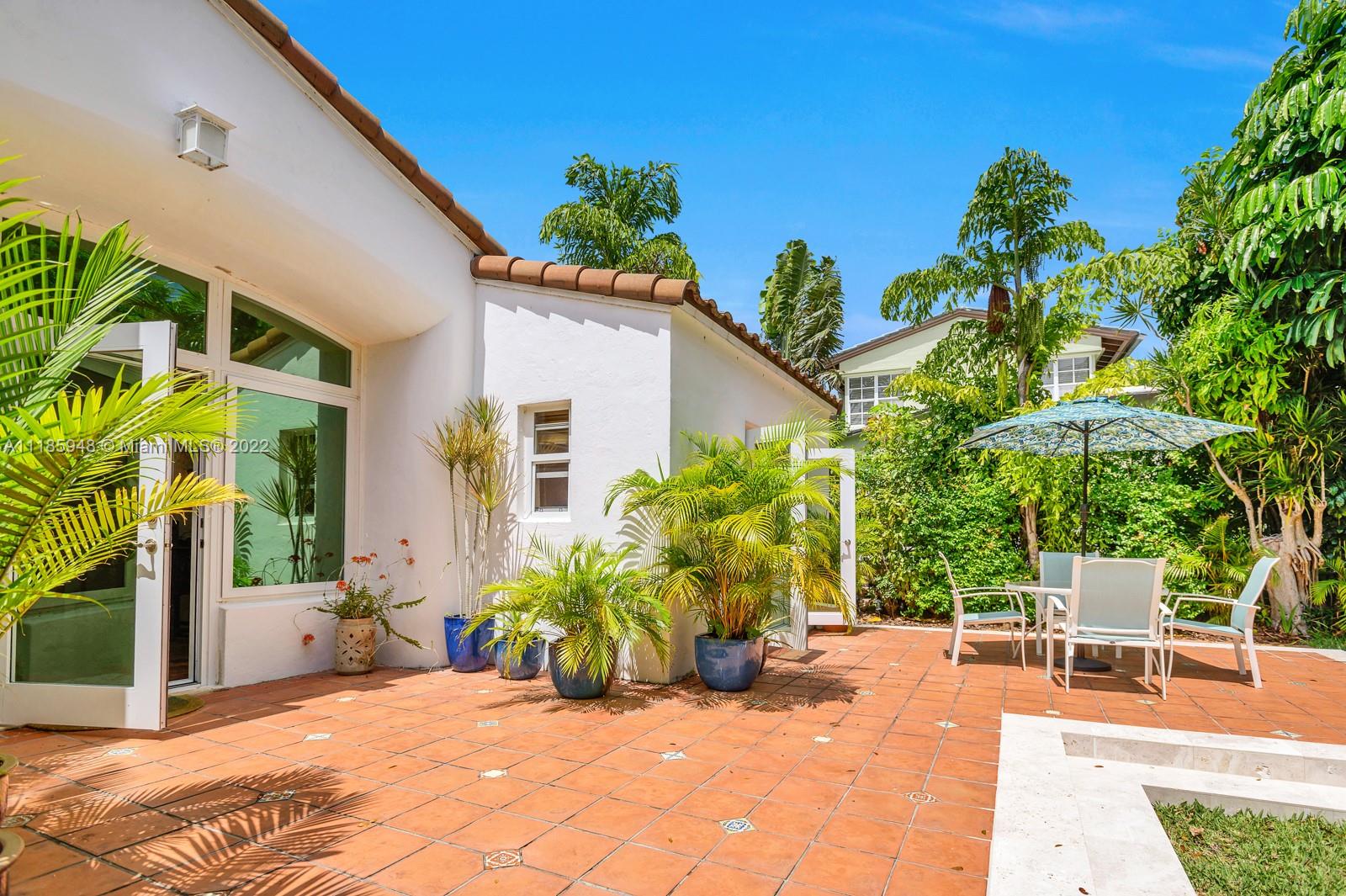 5429 Alton Road Miami Beach, FL 33140 - Photo 16 of 20 a view of a chair and table in the patio
