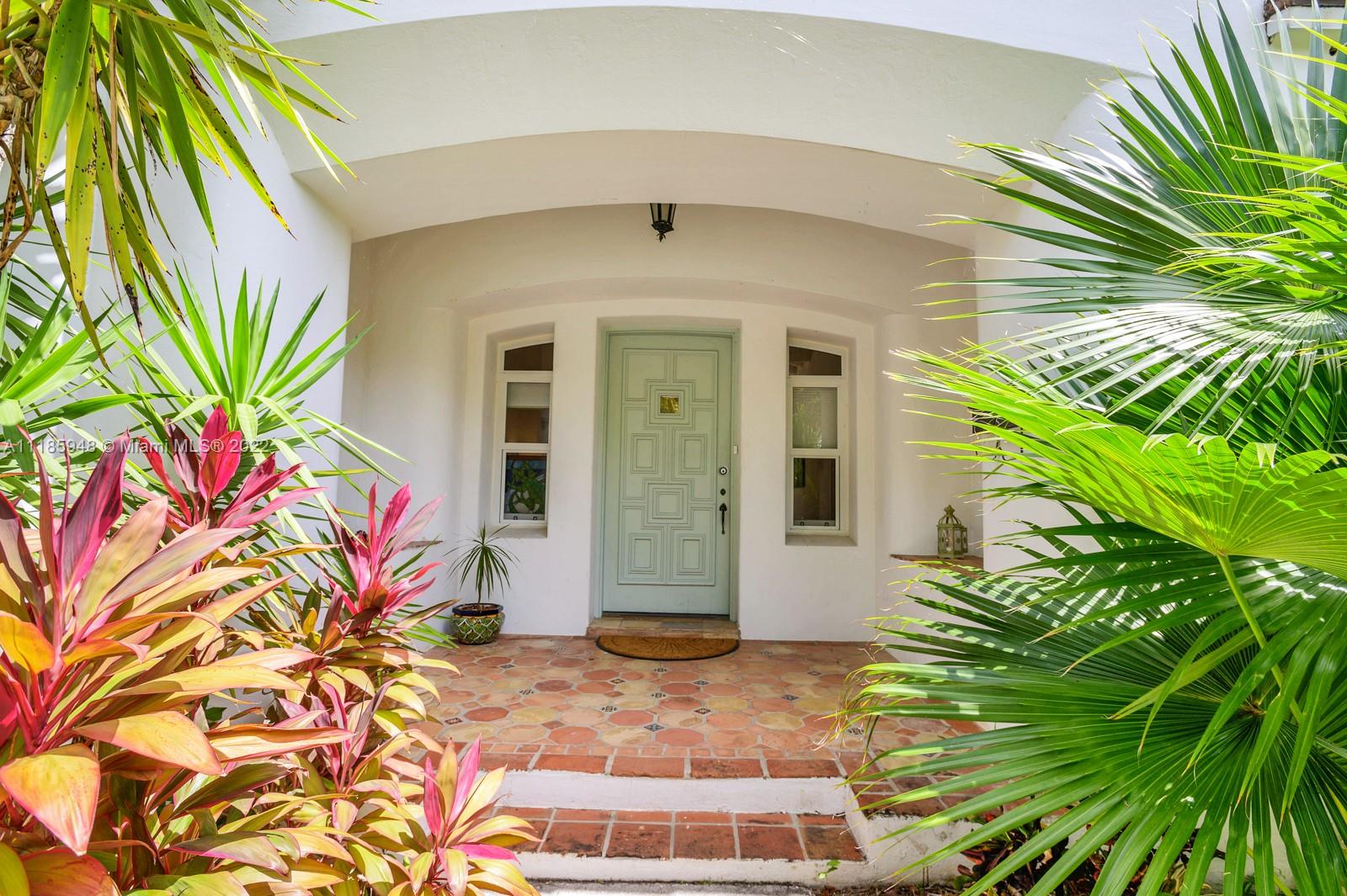 5429 Alton Road Miami Beach, FL 33140 - Photo 2 of 20 a front view of a house with a garage
