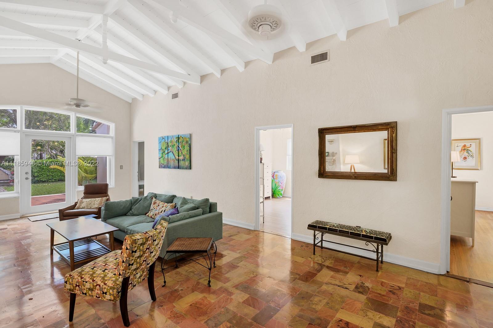 5429 Alton Road Miami Beach, FL 33140 - Photo 3 of 20 a living room with furniture and a window