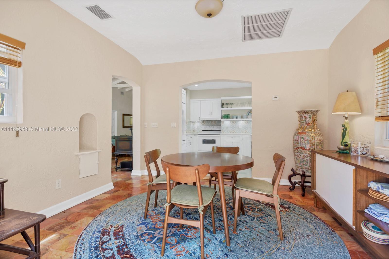 5429 Alton Road Miami Beach, FL 33140 - Photo 6 of 20 a dining room with furniture and wooden floor