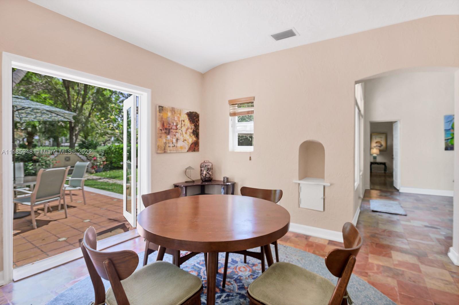 5429 Alton Road Miami Beach, FL 33140 - Photo 7 of 20 a view of a dining room with furniture window and outside view
