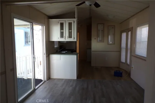 a kitchen with a refrigerator and a stove