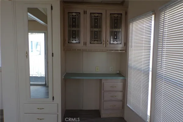 a view of cabinet and mirror