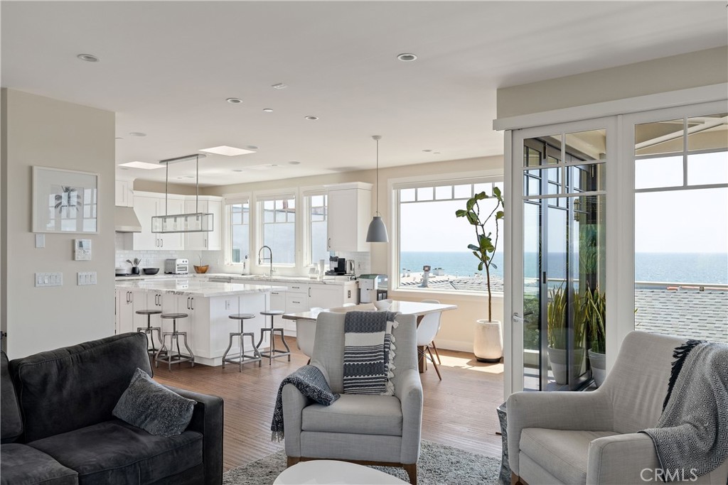 124 23rd Street Manhattan Beach, CA 90266 - Photo 11 of 50 a living room with furniture a large window and stainless steel appliances