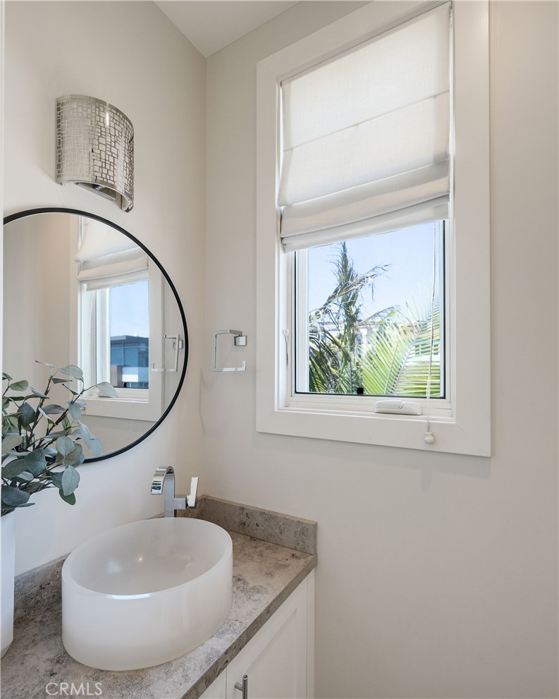 124 23rd Street Manhattan Beach, CA 90266 - Photo 31 of 50 a bathroom with a sink and a mirror