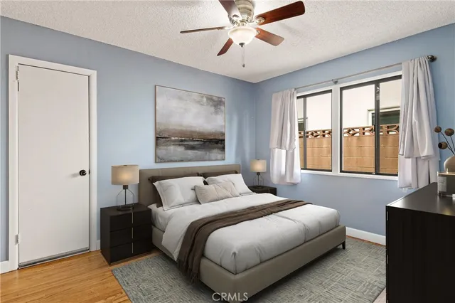 a bedroom with a large bed and a window