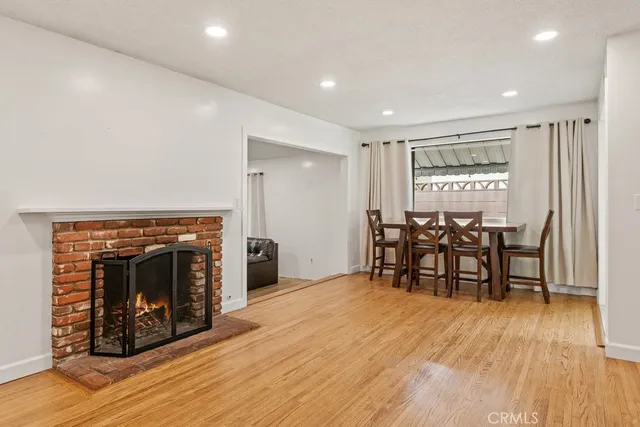 a view of dining room with furniture and wooden floor