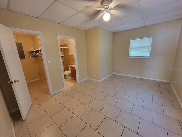wooden floor in an empty room with a mirror