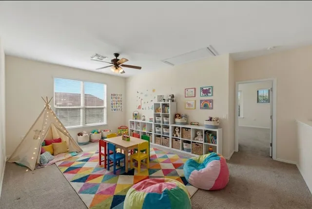 a living room filled with furniture and a chandelier