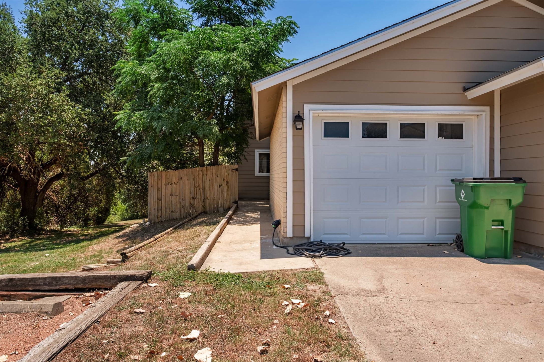 3904 Hudson Bend Road, Unit A Austin, TX 78734 - Photo 22 of 23 Garage featuring concrete driveway