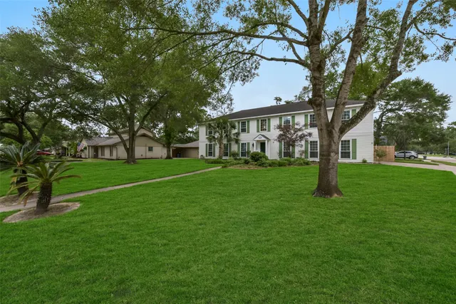 a view of a house with a big yard
