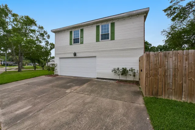 a view of a backyard of the house