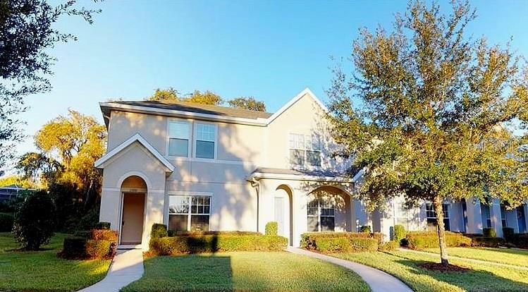 15810 Fishhawk View Drive Lithia, FL 33547 - Photo 1 of 1 a front view of a house with a yard table and chairs