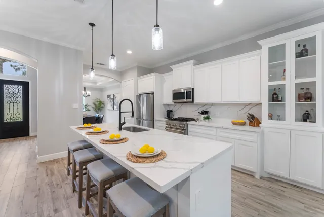 a kitchen with sink and stove