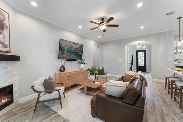 a living room with furniture and a fireplace