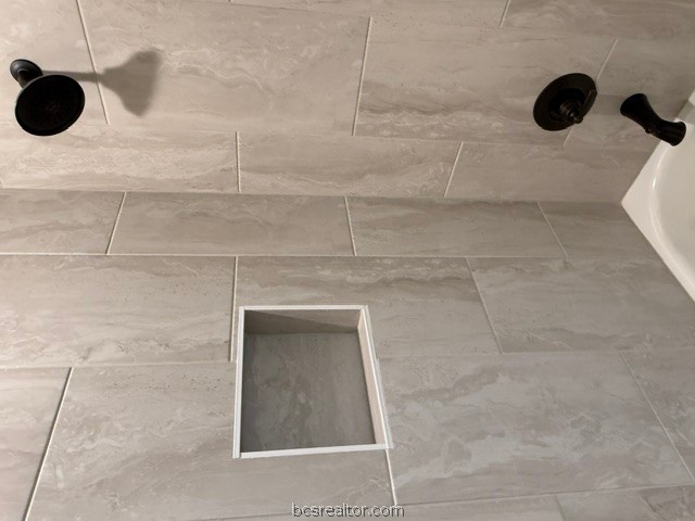 6428 Raleigh Loop College Station, TX 77845 - Photo 13 of 20 a bathroom with a shower