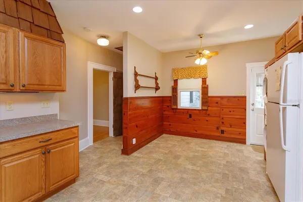 a kitchen with cabinets and window