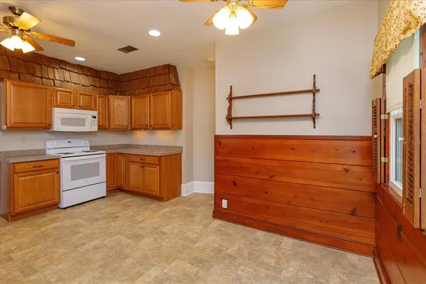 a kitchen with stainless steel appliances a stove sink and cabinets