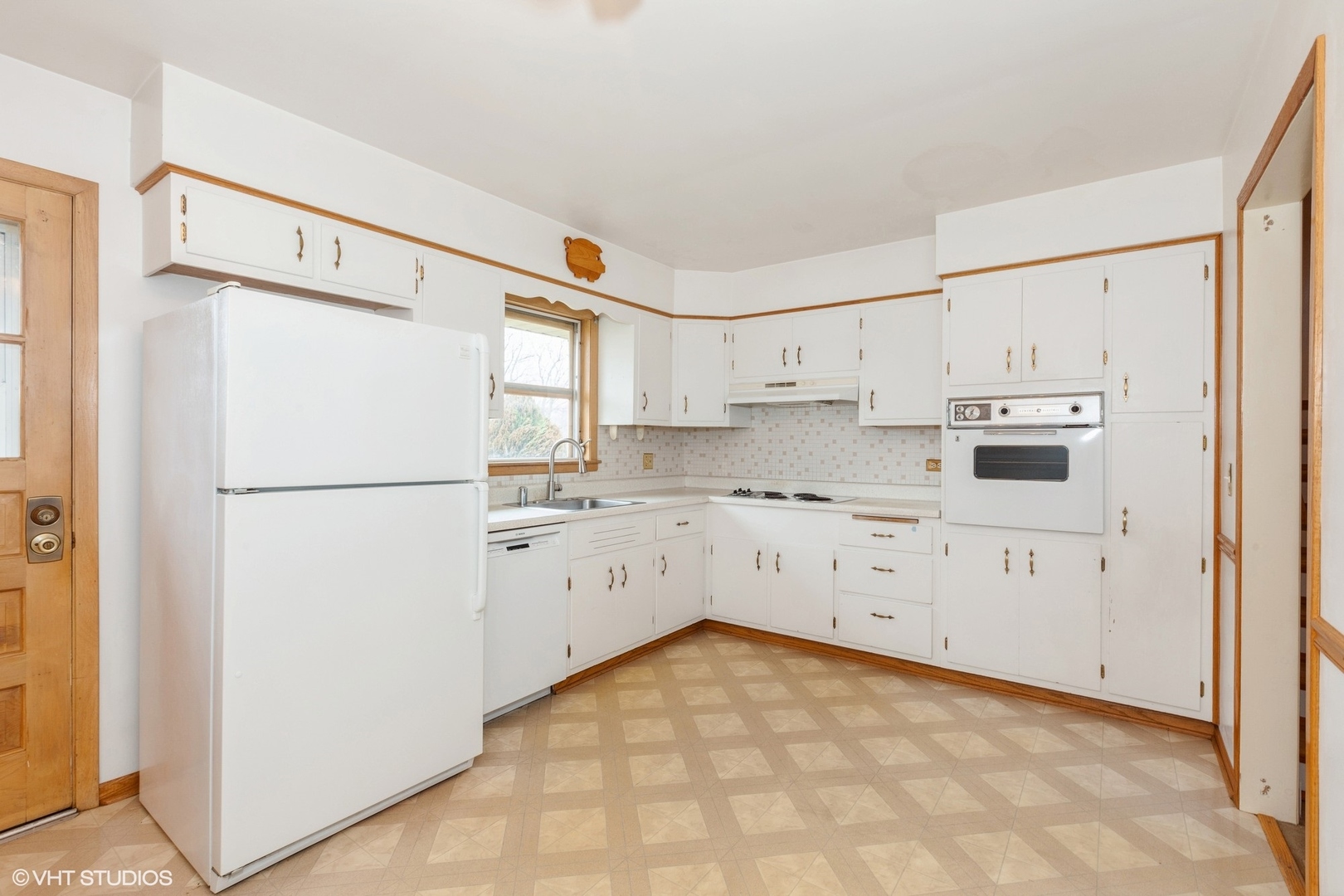 1330 South Main Street Wheaton, IL 60189 - Photo 6 of 19 a kitchen with white cabinets and white stainless steel appliances