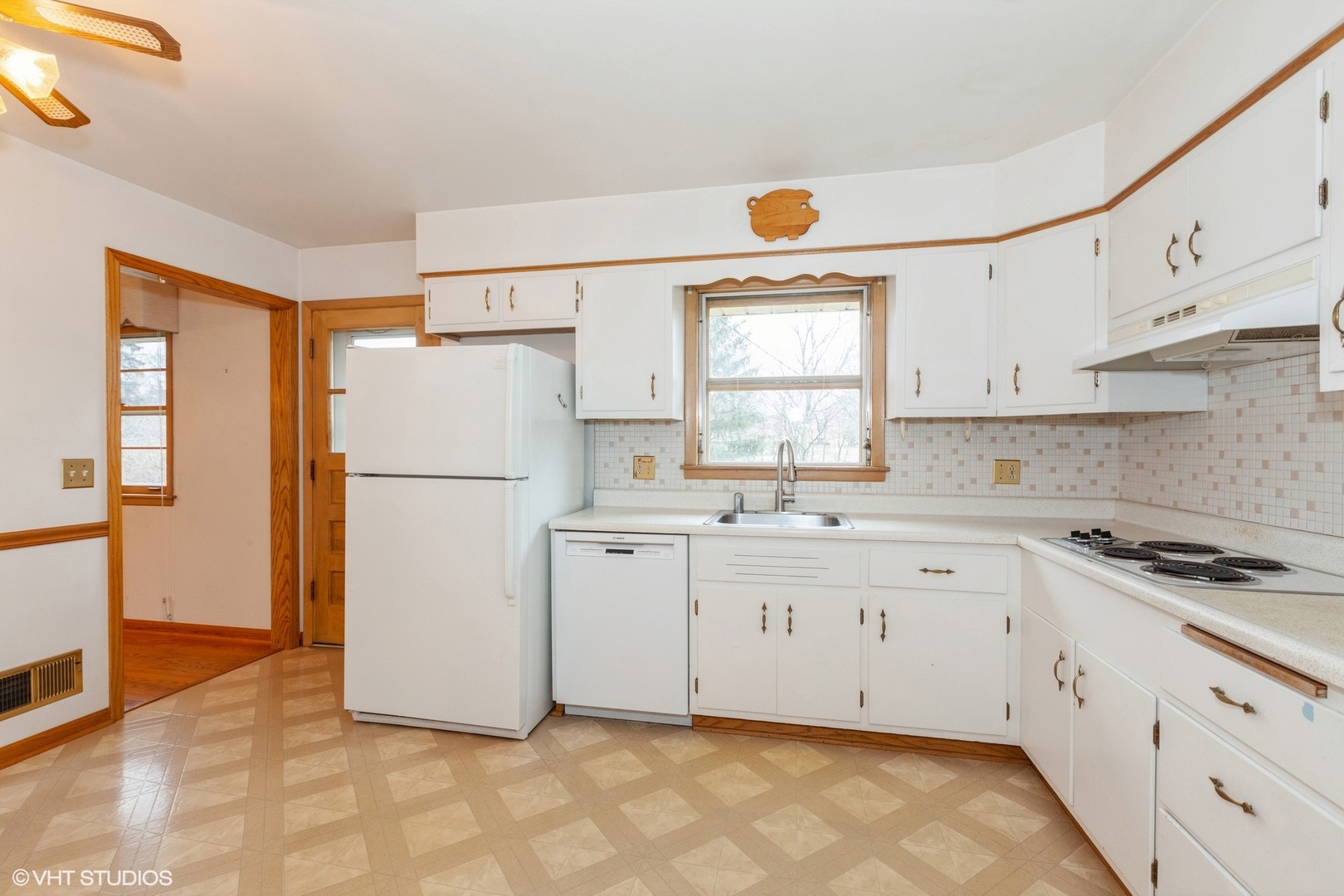 1330 South Main Street Wheaton, IL 60189 - Photo 7 of 19 a kitchen with granite countertop white cabinets and white appliances