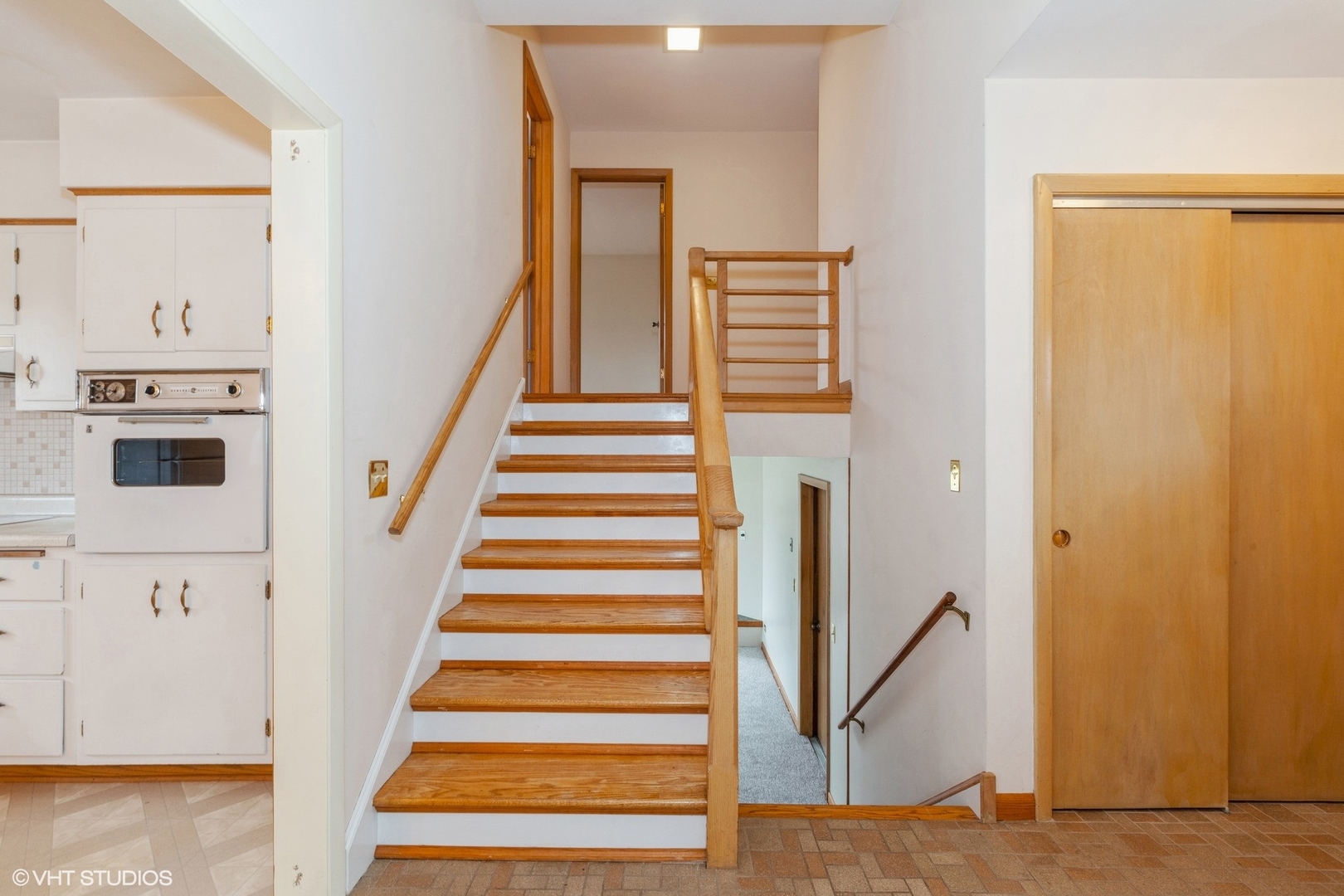 1330 South Main Street Wheaton, IL 60189 - Photo 8 of 19 a view of a hallway with staircase and white walls