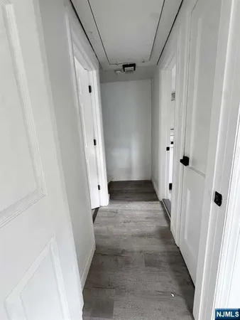 a view of bedroom with wooden floor