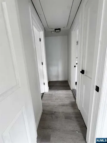 a view of bedroom with wooden floor