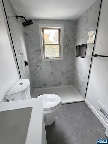 a bathroom with a sink and toilet
