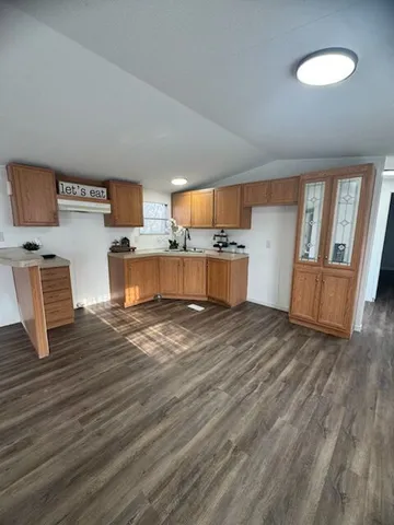 a view of kitchen and wooden floor