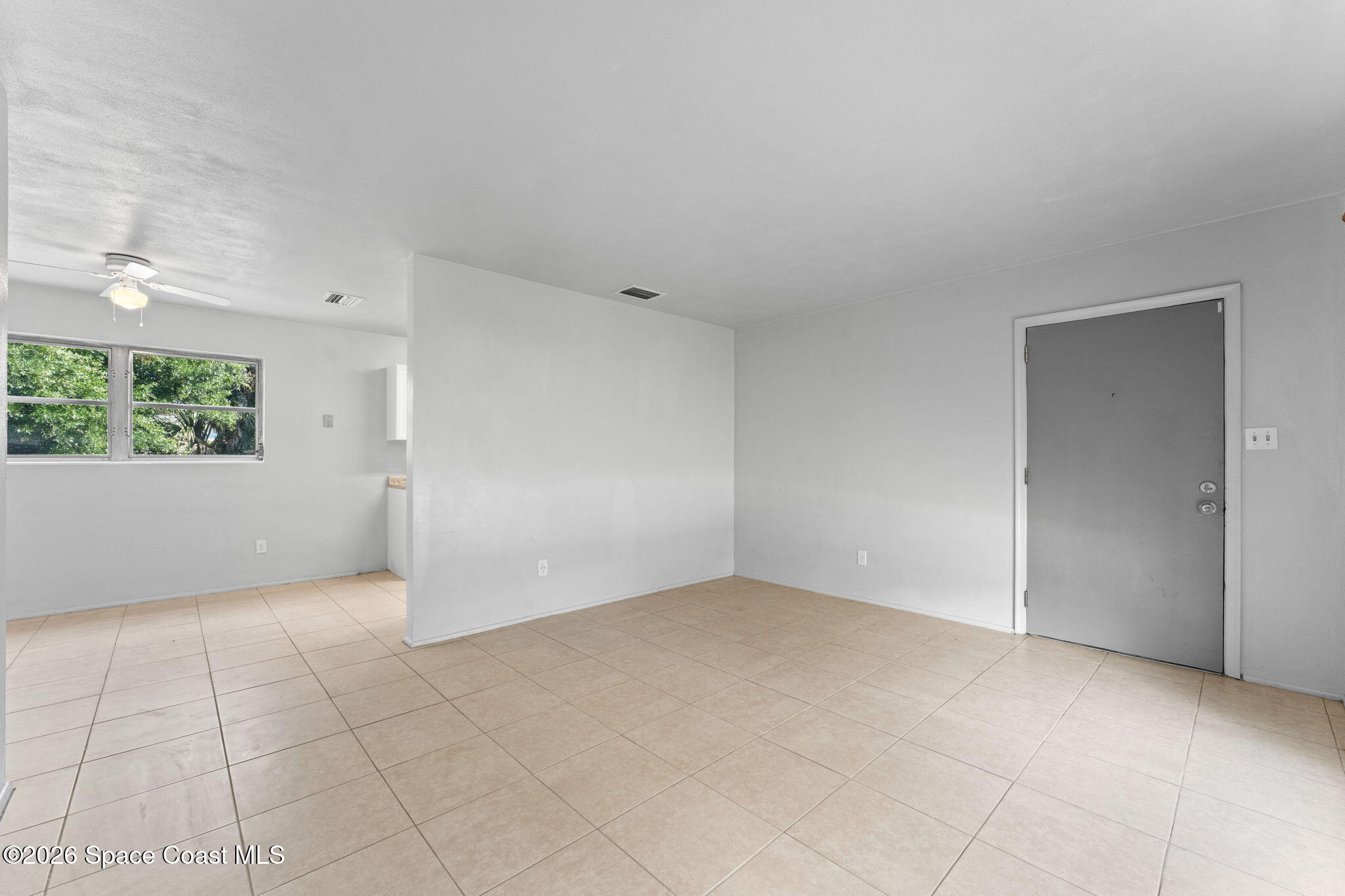1042 Azalea Lane Cocoa, FL 32922 - Photo 5 of 26 an empty room with windows