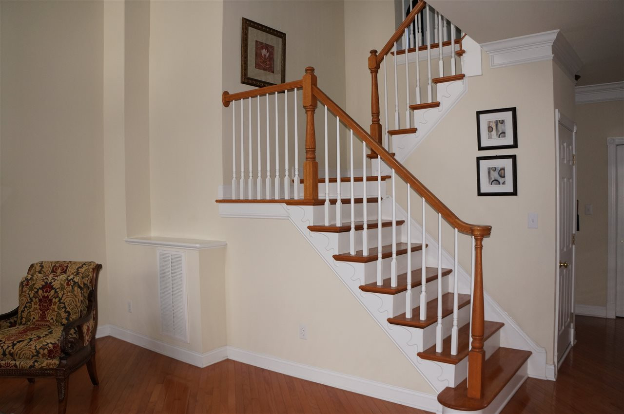 10913 Clovermill Circle Raleigh, NC 27617 - Photo 17 of 25 Architectually appealing staircase to the 2nd level. Staircase to 2nd floor