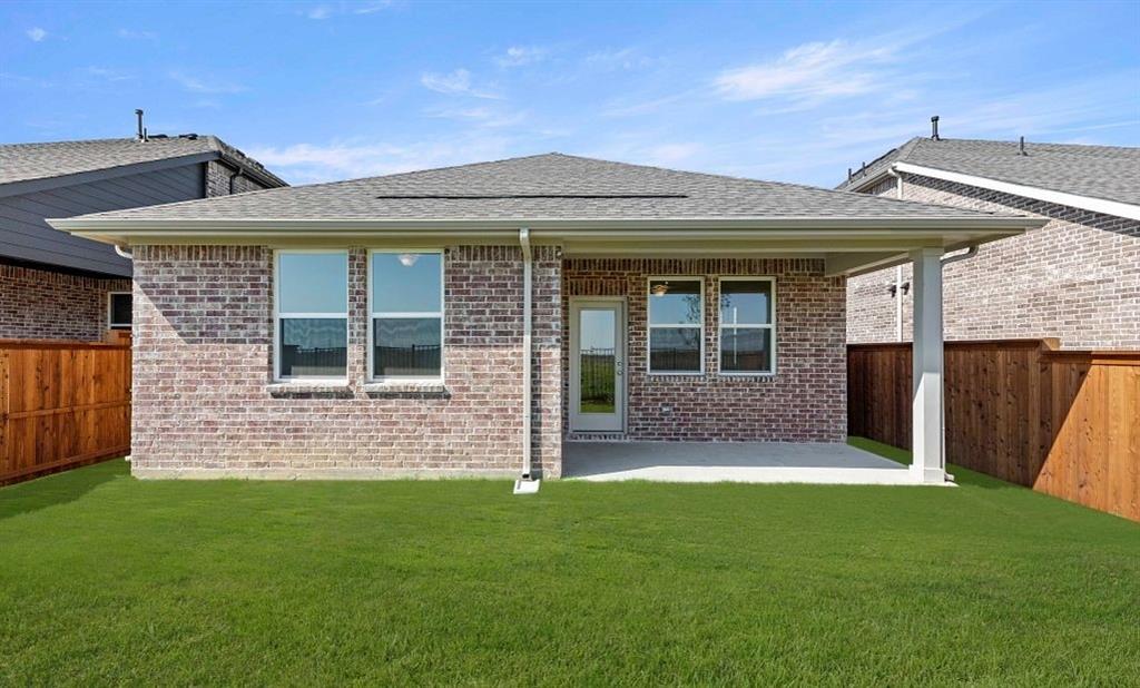 14200 Gallatin Street Pilot Point, TX 76258 - Photo 3 of 14 a front view of a house with a garden