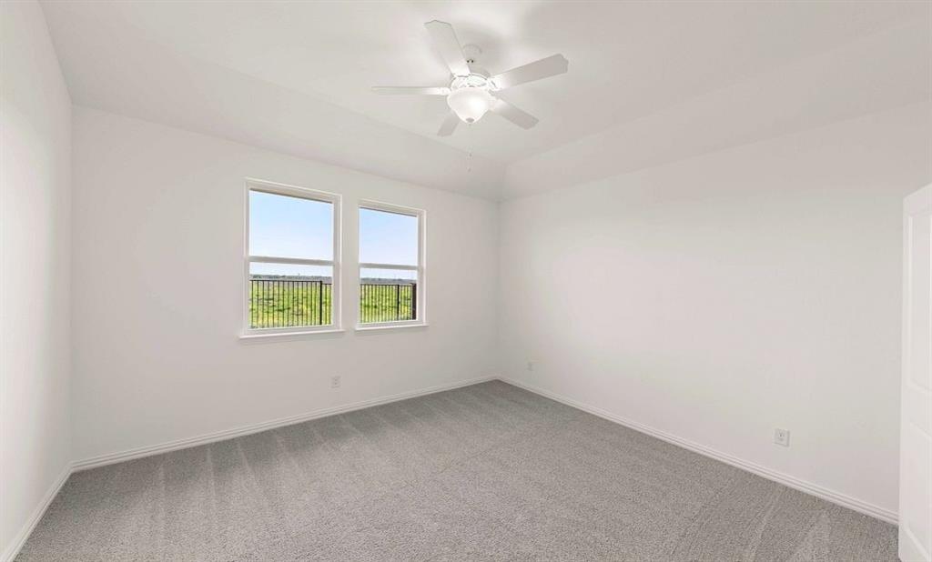 14200 Gallatin Street Pilot Point, TX 76258 - Photo 10 of 14 an empty room with a window