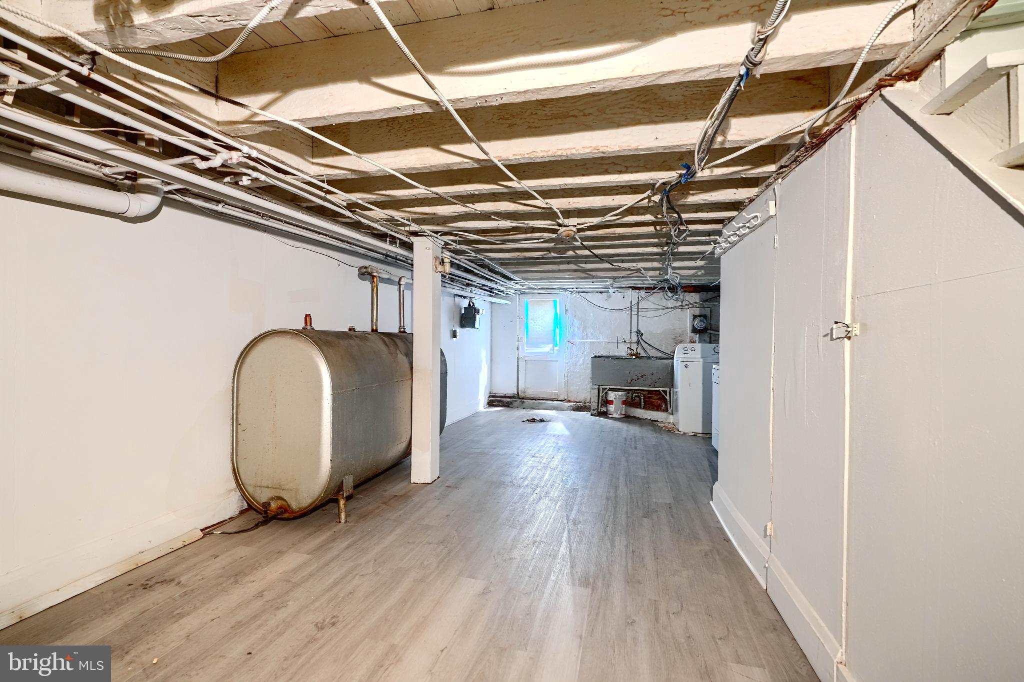 216 South High Street Baltimore, MD 21202 - Photo 22 of 25 a view of a utility room with wooden floor