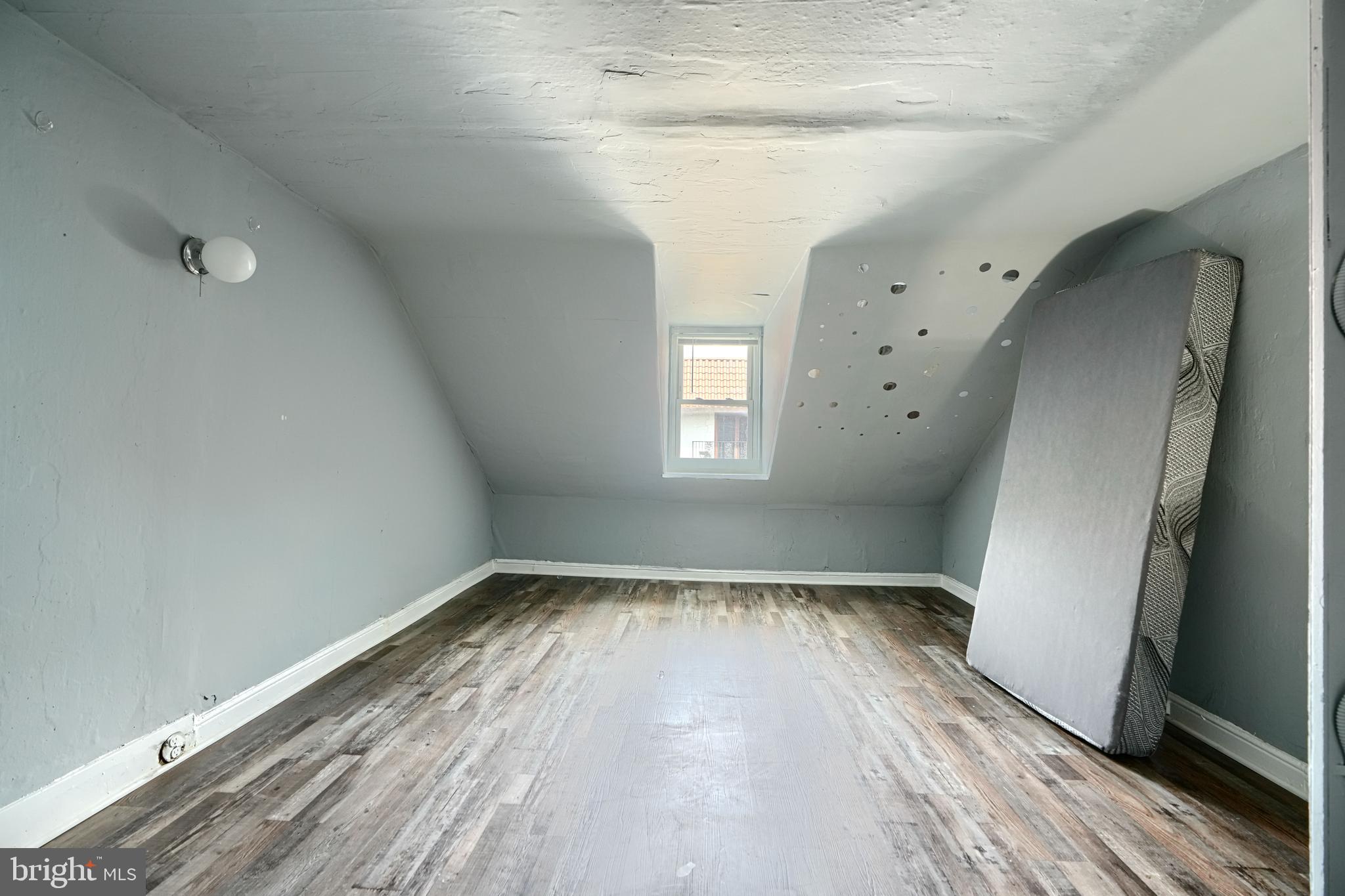 216 South High Street Baltimore, MD 21202 - Photo 25 of 25 a view of empty room with wooden floor and fan